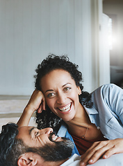 Image showing Love is about laughing together. Shot of a relaxed couple enjoying the day at home together.