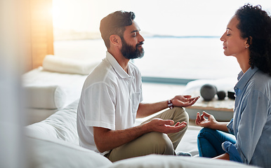 Image showing Finding their zen together. Shot of a relaxed couple meditating together at home.