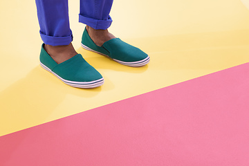 Image showing Colours and footwear. Cropped shot of footwear on a colourful background.