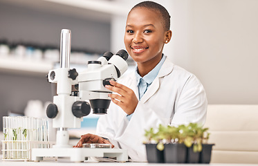 Image showing Science portrait, woman and plants, microscope or laboratory research for agriculture, sustainability and leaves test. Scientist, African student or happy doctor, lens and eco study or food security