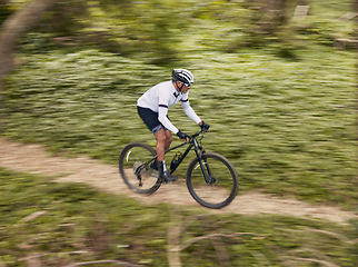 Image showing Cycling, fitness and man with mountain bike in forest for speed, training or nature workout with top view off road race. Extreme sports, bicycle or cyclist in woods for workout, performance or ride