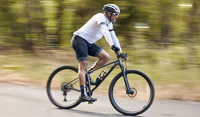 Image showing Nature, mountain bike or sports man travel, action and ride bicycle for triathlon challenge, journey or cardio. Cycling competition, fast motion blur or profile of cyclist training for race in France