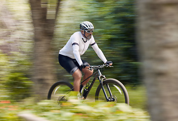 Image showing Freedom, fitness and man cycling in forest with energy, training or nature, workout and off road race. Speed, workout and cyclist on mountain bike for extreme sports, adrenaline or power performance