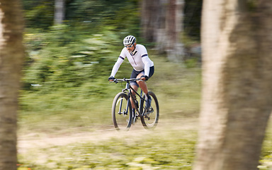 Image showing Forest blur, mountain bike and sports man cycling, action and ride bicycle for cardio, fitness or transportation. Sustainable, green nature trees and cyclist training, speed and travel in woods path