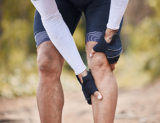 Image showing Fitness, knee pain and man hands in forest with cycling, sports or injury, muscle or joint accident outdoor. Leg, arthritis or athlete with fibromyalgia, emergency or cramps massage for osteoporosis