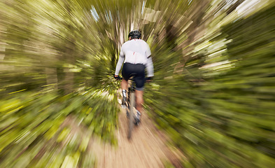 Image showing Blur motion, cycling and man in nature training for a race, marathon or competition in a forest. Fast, fitness and back of male cyclist athlete riding bicycle at speed for cardio exercise or workout.