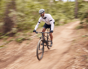 Image showing Cycling, fitness and man with bicycle in a forest for speed, training or workout in nature for off road hobby. Extreme sports, mountain bike and cyclist in woods for workout or adrenaline performance