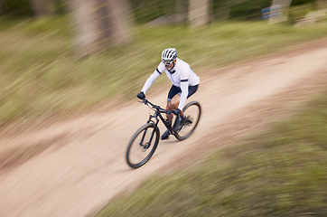 Image showing Nature, mountain bike speed and sports man travel, action and ride bicycle for cycling, fitness or exercise. Top view dirt path, fast motion blur and extreme cyclist training for race on forest land