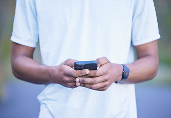 Image showing Hands, typing and man with phone for communication, contact or social media post on internet, website or network connection. Cellphone, mobile app or person with research online for fitness or health