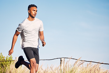 Image showing Man, running and training on road in mountain, nature or outdoor exercise and athlete in healthy workout or fitness. Male, runner and morning cardio, sports in summer or mockup of goals or motivation