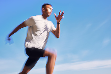 Image showing Fitness, exercise and speed of a man running outdoor for workout or training. Blurred athlete person or fast runner in nature for resilience, cardio performance or health on sky mockup space