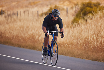 Image showing Fitness, nature and bicycle, man on road for workout exercise and scenic mountain path. Health, wellness and cyclist on bike on summer morning for training, practice and cycling race in countryside.