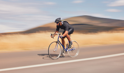 Image showing Speed, nature and road, man on bicycle for workout, exercise and scenic mountain path. Health, wellness and cyclist on bike for morning training, practice and cycling race, blue sky and fast motion.