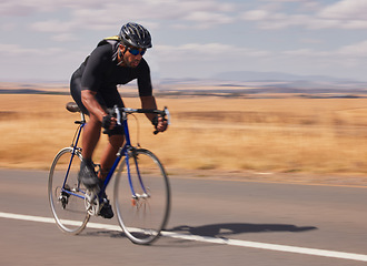 Image showing Speed, nature and man cycling on road for workout, exercise and scenic mountain path. Fitness, wellness and cyclist on fast bike on summer morning for training, practice and bicycle race with motion.