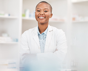 Image showing Crossed arms, smile and portrait of black woman pharmacist working in chemist for medication dispensary. Happy, confident and African pharmaceutical worker in medicine pharmacy for healthcare career.