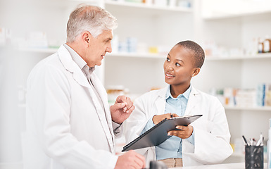 Image showing Man, woman and clipboard in pharmacy for checklist, insurance documents and stock report for medicine. Help, mentor and pharmacist team at counter with inventory list, schedule or medical information
