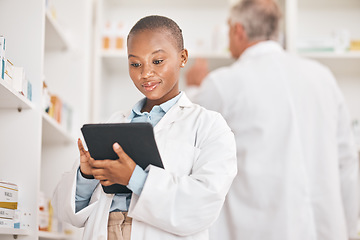 Image showing Inventory, pharmacist and black woman with a tablet, healthcare and research with connection in a drugstore. Medical, pharmaceutical and African person with technology, network or check prescription