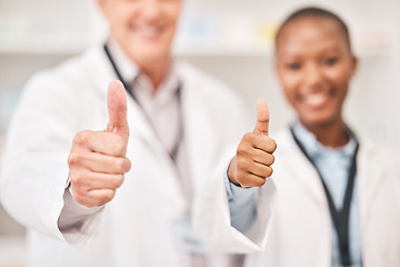 Image showing Pharmacist man, woman and thumbs up in shop, retail store or hospital for feedback, review or good service. Pharmaceutical team, together and happy with icon, sign language and opinion in hospital