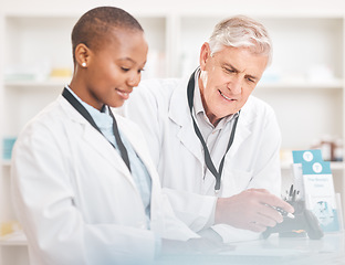 Image showing Man, woman and paperwork in pharmacy for checklist, schedule or stock report for medicine. Help, mentor and pharmacist team at counter with inventory list, medical insurance documents or information.