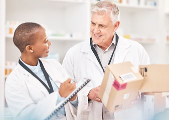 Image showing Man, woman and package in pharmacy for checklist, delivery schedule or stock report for medicine. Help, mentor and pharmacist team with inventory list, boxes of pharmaceutical product or medical info