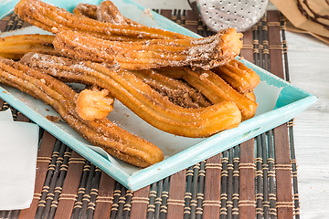 Image showing Traditional churros with hot chocolate 