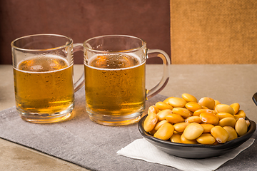 Image showing Tasty lupins and glass of beer