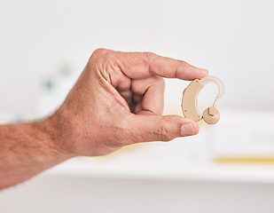 Image showing Hearing aid, hands and person with disability for medical support, healthcare innovation and volume. Closeup of deaf patient with audiology implant to help sound waves, amplifier or improve listening