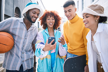 Image showing Gen z friends group, phone and city with meme, laugh and reaction to social media, blog and happy in street. Students, men and women with smartphone, comic video or post on web in Los Angeles metro