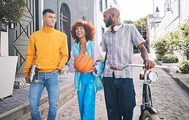 Image showing Friends, city and people with a basketball and bicycle outdoor for travel, fashion and fun. Diversity, happiness and student group of men and woman laugh for adventure and freedom on urban street