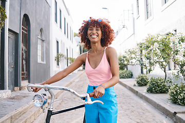 Image showing Bike, gen z or portrait of happy woman cycling with street fashion in urban outdoor activity on holiday. City girl, streetwear and sustainable transport, carbon neutral travel on bicycle in road