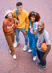 Image showing Happy friends, city and portrait with a basketball outdoor for sports, fashion and fun. Diversity, gen z and student group of men and women smile for adventure and relax on urban street from above