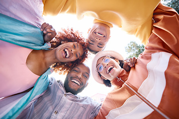 Image showing Portrait, smile and a group of friends in a huddle outdoor together for freedom, bonding or fun from below. Diversity, travel or summer flare with happy men and women laughing outside on vacation
