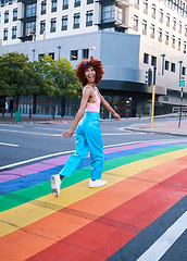 Image showing Happy, walking and a woman on a pride street for a celebration of freedom of love. Smile, city and a girl or person in support of lgbt community on a rainbow road for equality, excited and identity