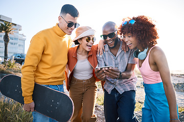 Image showing People, phone and friends laughing outdoor for meme, funny video and fun. Diversity, happiness and gen z group of men and women with a smartphone for social media, skateboard and freedom in city