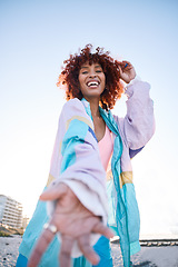 Image showing Portrait, happy woman and helping hand, offer or invitation at beach in low angle mockup space. Smile, palm and African person giving assistance in support, care or acceptance of handshake to welcome