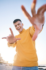 Image showing Frame, summer and a man with hands at the beach with happiness, freedom and creativity. Smile, portrait and a young person at the sea with a gesture for perspective on a vacation at the ocean