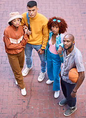 Image showing Friends, city and portrait with basketball outdoor for sport, cool fashion and serious pose. Diversity, gen z and student group of men and woman for adventure and youth on urban street from above