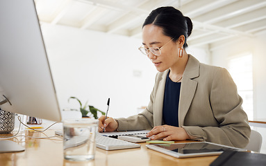 Image showing Finance, budget and business woman writing in office for savings, tax or investment growth with calculator. Solution, planning and asian female financial advisor with sales, review and brainstorming