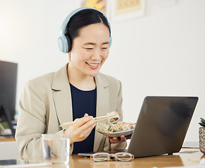 Image showing Japanese business woman, laptop and sushi on lunch, video or movie in office for thinking, headphones and happy. Asian entrepreneur, eating seafood and comedy with computer, chopsticks and streaming