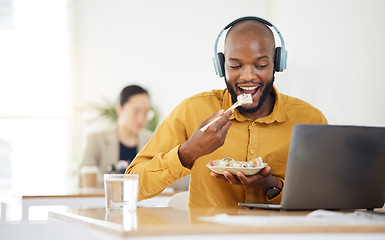 Image showing Black business man, laptop and sushi on lunch, video or movie in office for social media, headphones or streaming. African entrepreneur, eating seafood and health on computer, chopsticks or nutrition