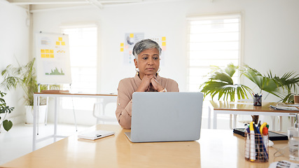 Image showing Thinking, anxiety and senior woman with laptop in office worry, waiting and checking email for report. Stress, face and female ceo online for review, feedback or research, problem or deadline mistake