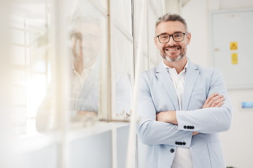 Image showing Smile, executive and portrait of a businessman with arms crossed in an office for professional pride. Happy, corporate and a mature manager or ceo working with confidence in workplace management