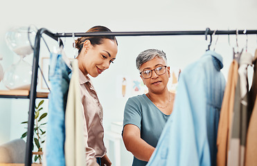 Image showing Consultant, fashion and shopping with customer in shop for advice on fabric or products on promotion. Stylist mature retail or women talking in boutique mall for clothes deal, help or discount offer