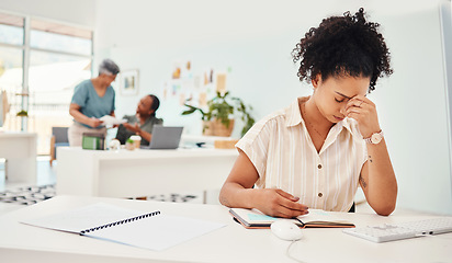 Image showing Anxiety, headache and a business woman writing in her notebook while working to a deadline in the office. Stress, depression and compliance with a young fashion designer planning an artistic project