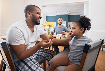 Image showing Gay couple, breakfast or child with father wipe, cleaning or remove food, morning meal or cereal from mouth of girl. Happy family, adoption or non binary dad smile for hungry youth kid eating at home