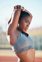 Image showing Sports, exercise and woman stretching outdoor at a stadium for workout, training and warm up. African athlete person for muscle stretch, fitness and wellness or flexibility for a run or competition