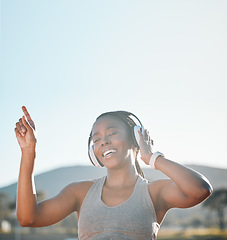 Image showing Headphones, dancing and black woman at fitness training or outdoor workout for health wellness and enjoy music. Smile, African and athlete or person streaming audio or radio for exercise in a park