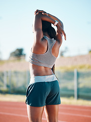 Image showing Stretching, sports and exercise with a woman outdoor on a track for running, training or workout. Behind African athlete person at stadium for arm stretch, fitness and muscle warm up or body wellness