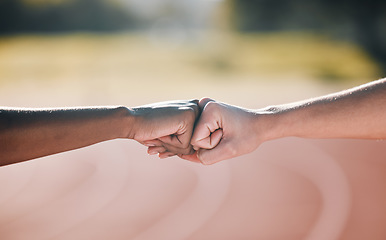 Image showing Closeup, fitness and fist bump for sports support, motivation and goal in training. Stadium, together and people with a gesture or hands for workout or exercise solidarity for a race or competition