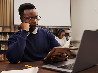 Image showing University, education and black man student reading and learning in a college for knowledge development. Serious, books and person studying research to prepare for exam or assignment in a class
